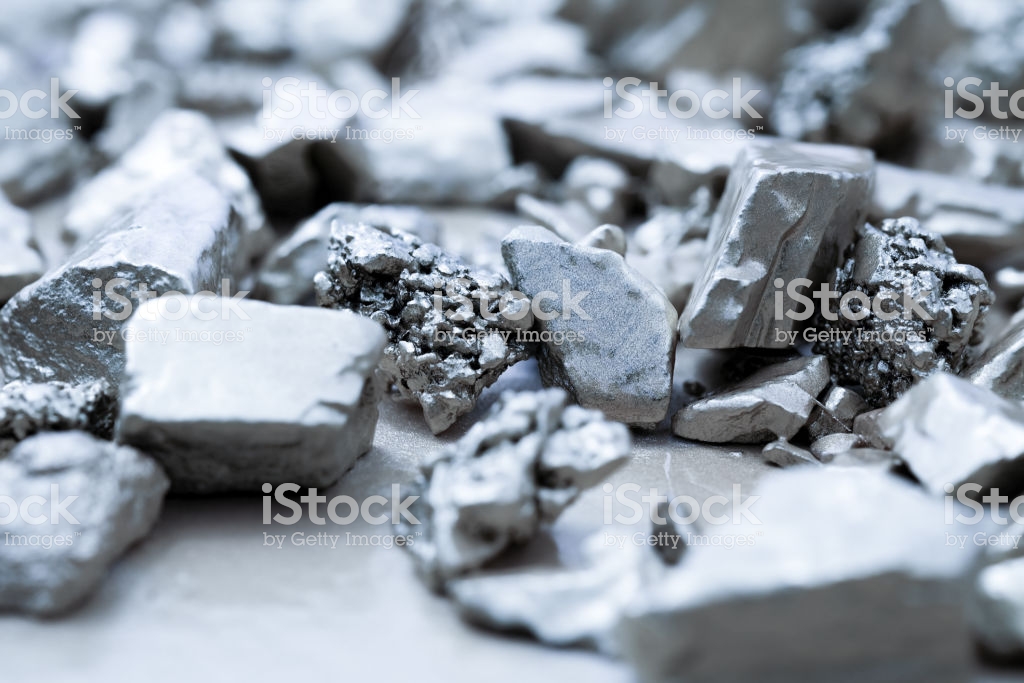 lump of silver or platinum on a stone floor