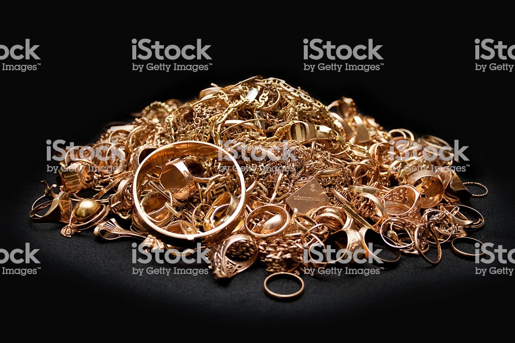 Scrap gold jewelry on black background